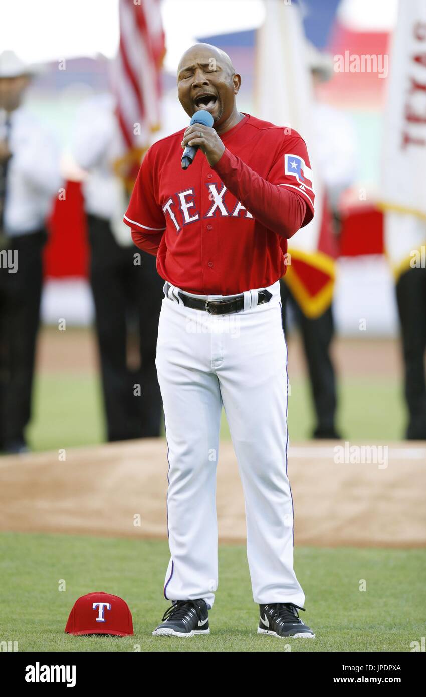 Texas Rangers third base coach Tony Beasley sings the national anthem