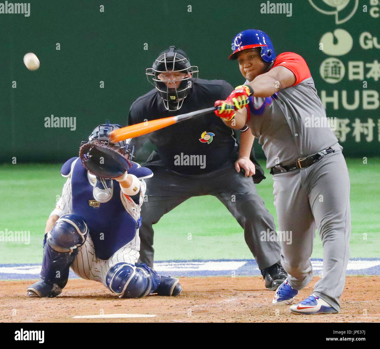 Cuba's Alfredo Despaigne hits a home run off Japan's pitcher Takahiro