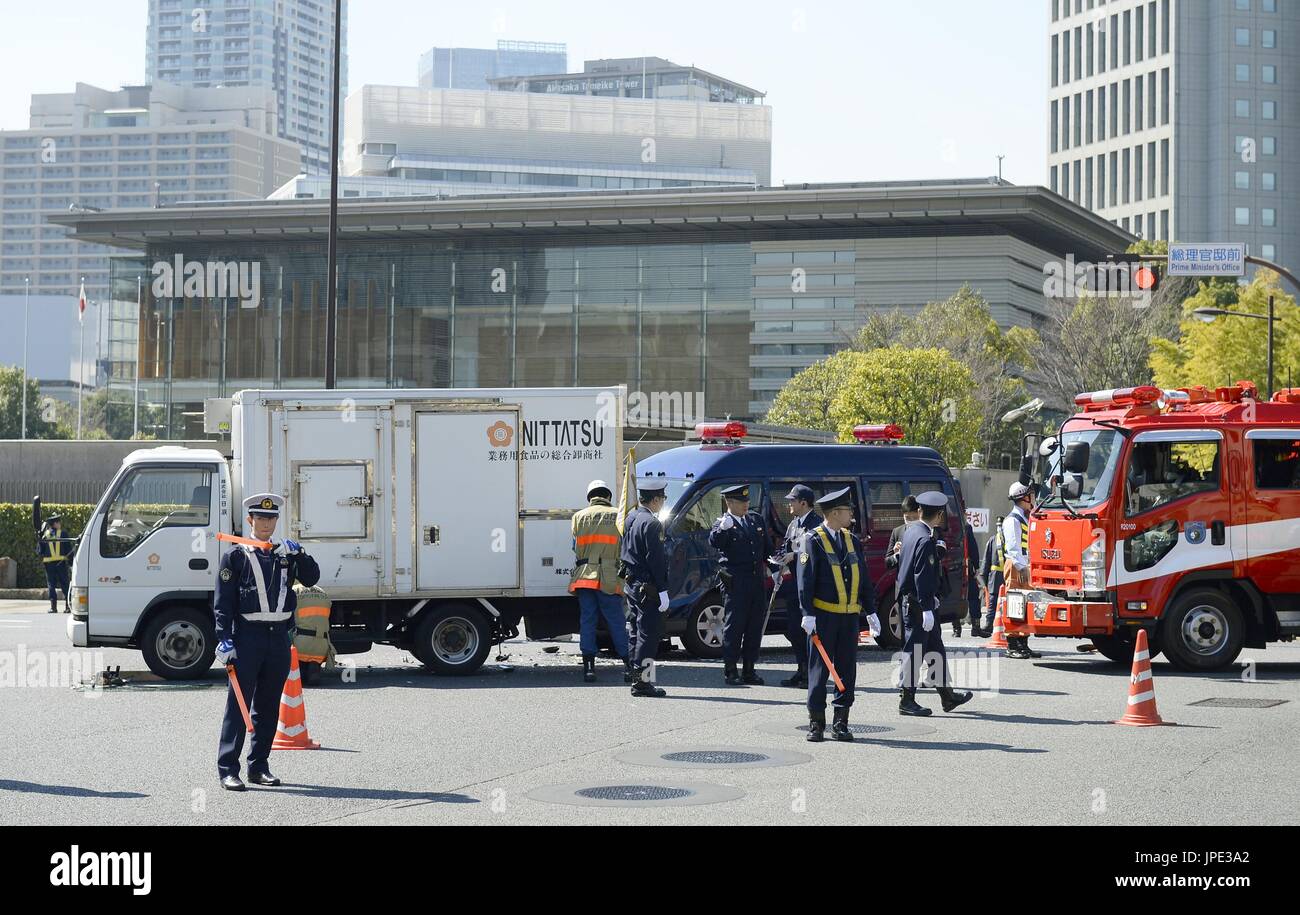 Police officers gather at an intersection in front of Japanese Prime ...