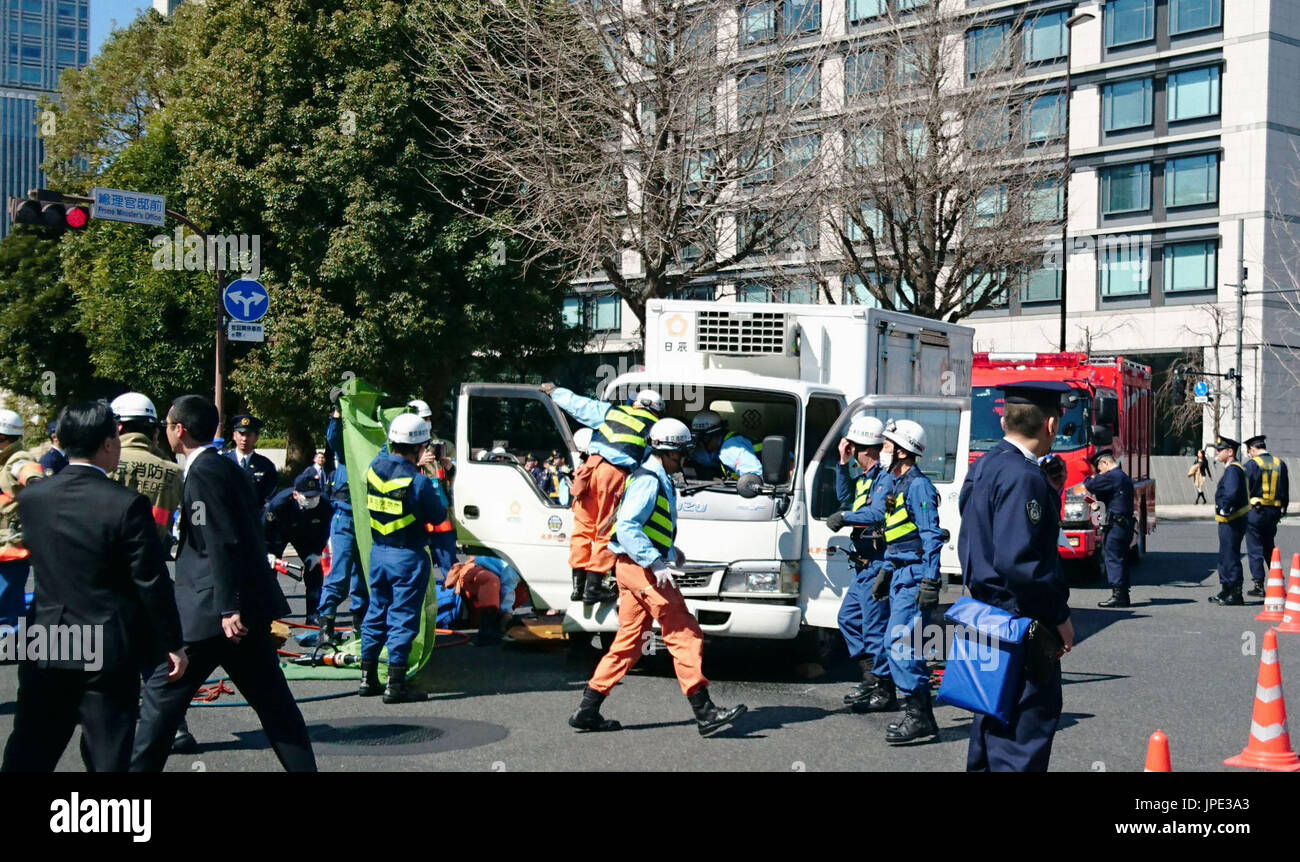 Police officers gather at an intersection in front of Prime Minister ...