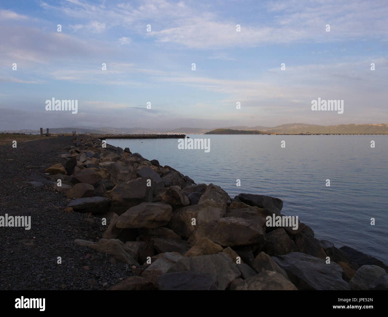 Calm water rocky shoreline hi-res stock photography and images - Alamy