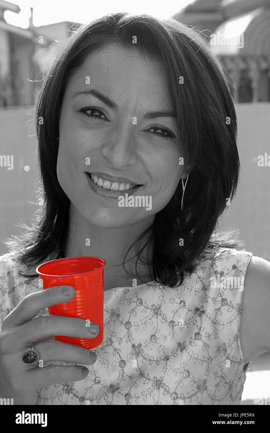 The importance of a red glass to stand out in a gray world Stock Photo