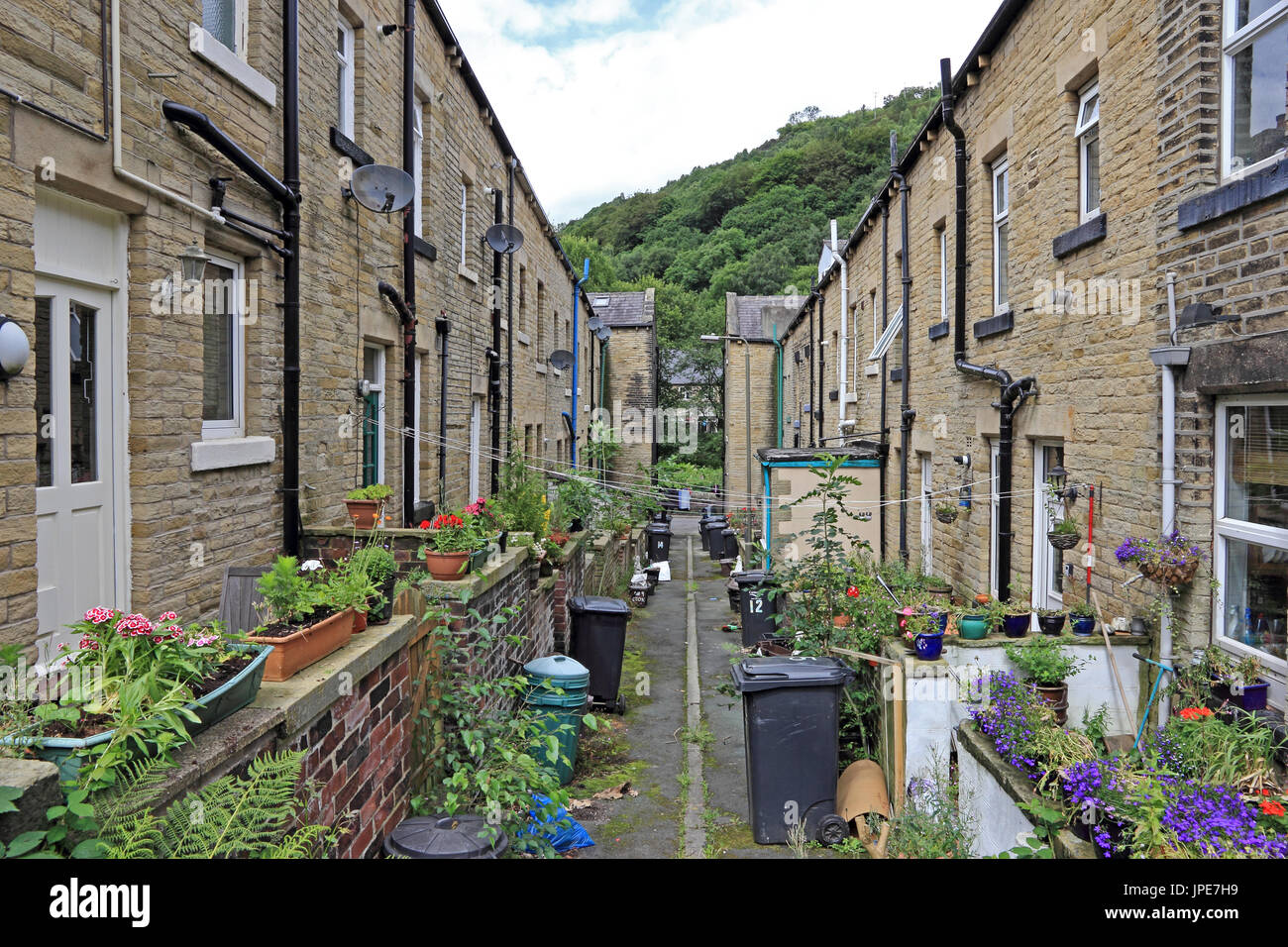Alley between backs of rows of traditional terraced houses, Hebden