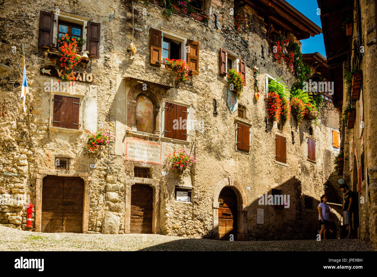 Canale, Tenno, Province of Trento, Trentino Alto Adige, Italy. Medieval village on mountain above lake. Stock Photo