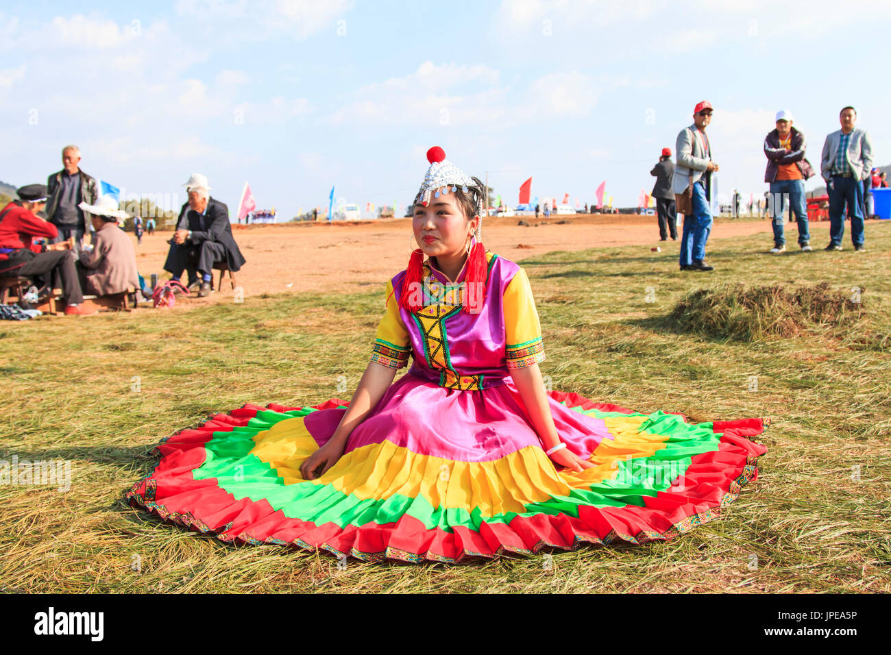 Chinese girl in traditional Chinese clothing during the Heqing Qifeng Pear Flower festival, China Stock Photo