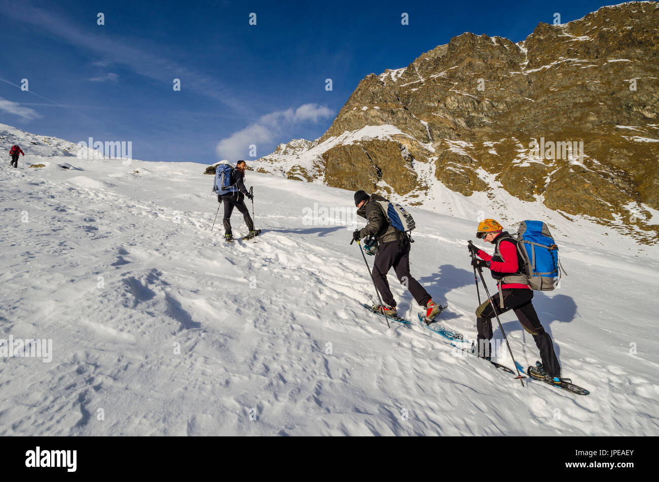 Hikers in high Lauson Valley (Cogne valley, Gran Paradiso National park, Aosta Valley, Italy) Stock Photo