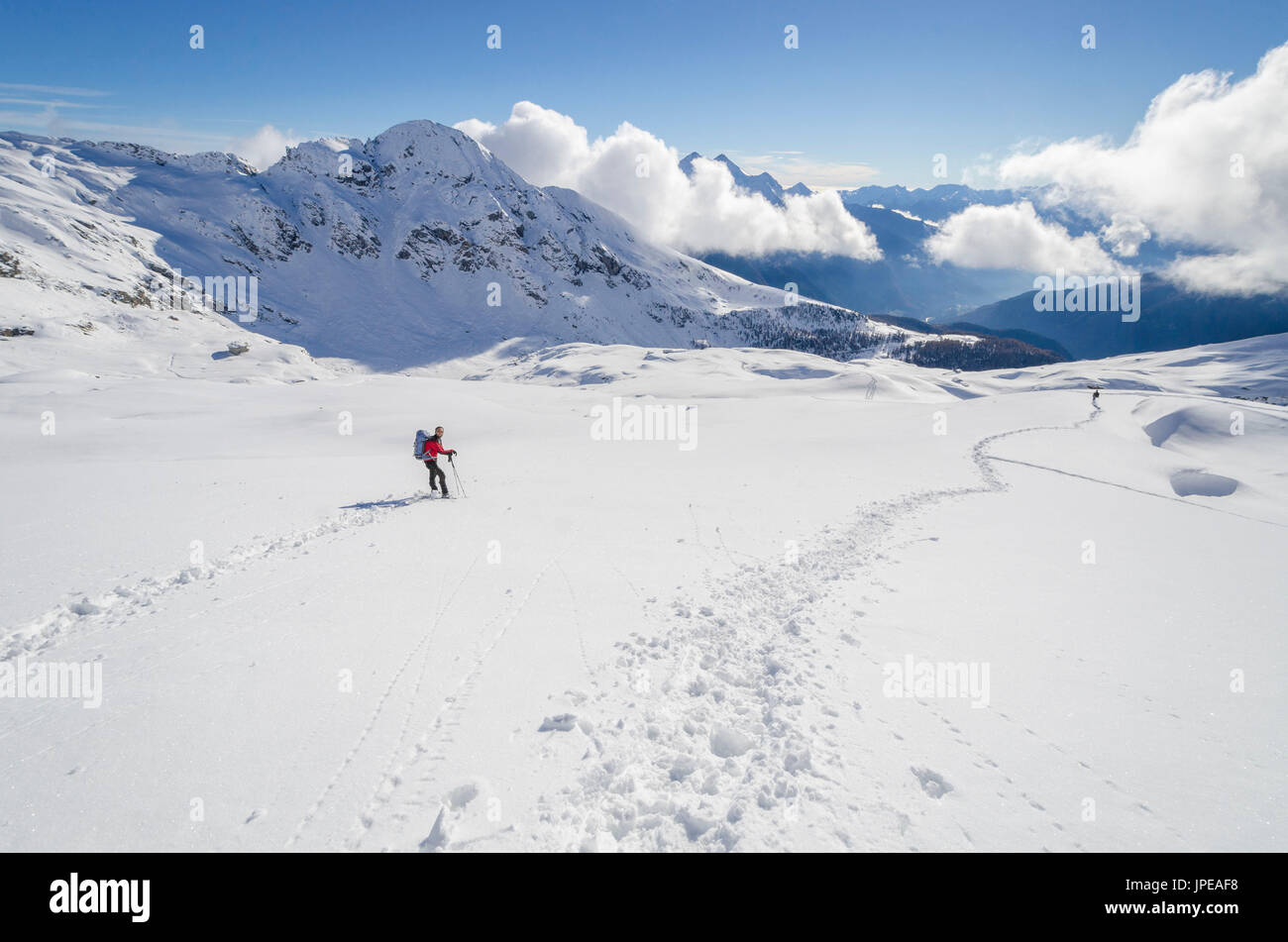 Snowshoeing in Ayas valley, Aosta Valley, Italian alps, Italy Stock Photo