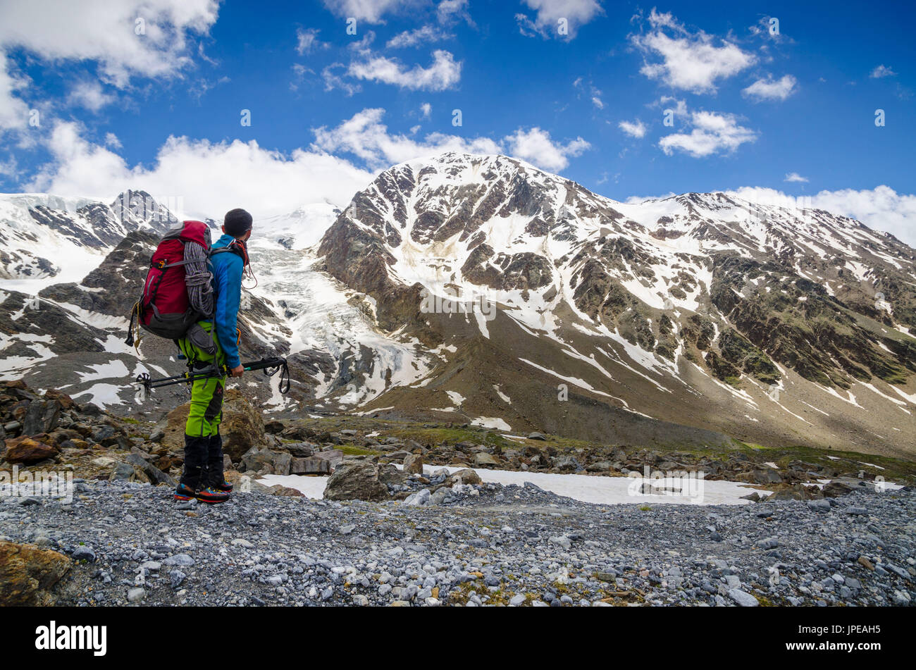Mountaineer contemplate glaciers (Valtellina, Lombardy, Italian Alps) Stock Photo