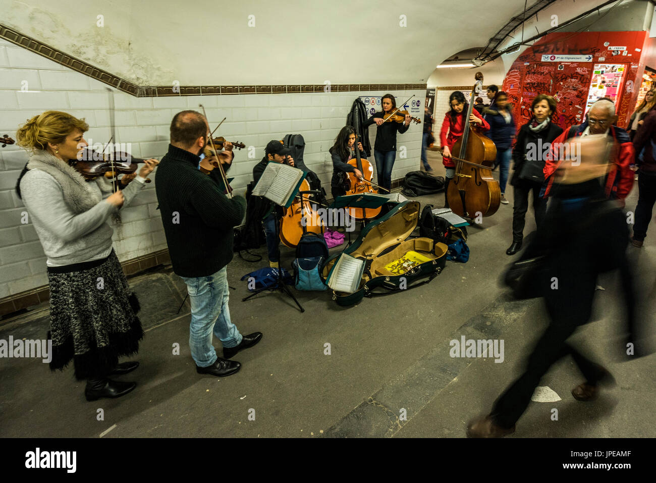 A group of street musicians perform in the Paris subway.Paris, France Stock Photo