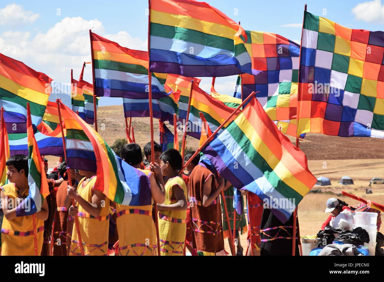 Parade participants in colorful traditional clothing get ready to perform in Peru Stock Photo