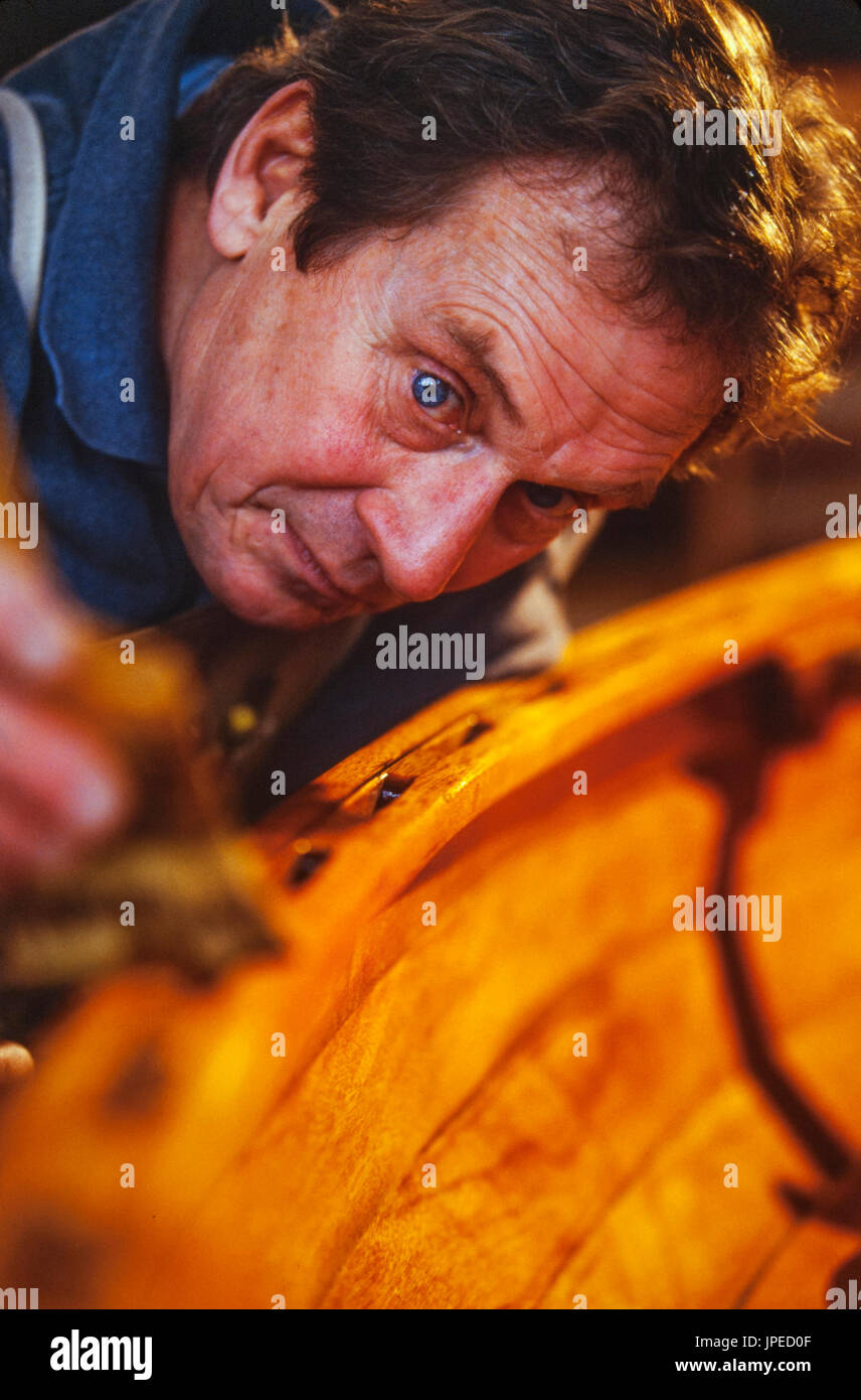 Master wooden boat builder Ted Schleisman of Ashland, Oregon works in his small shop on a mountainside. Stock Photo