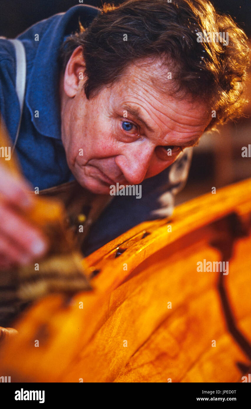 Master wooden boat builder Ted Schleisman of Ashland, Oregon works in his small shop on a mountainside. Stock Photo