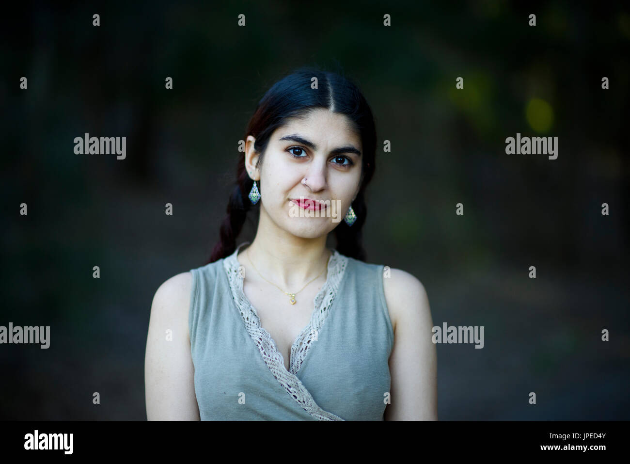 Young Persian Woman poses for photos in a Park Stock Photo