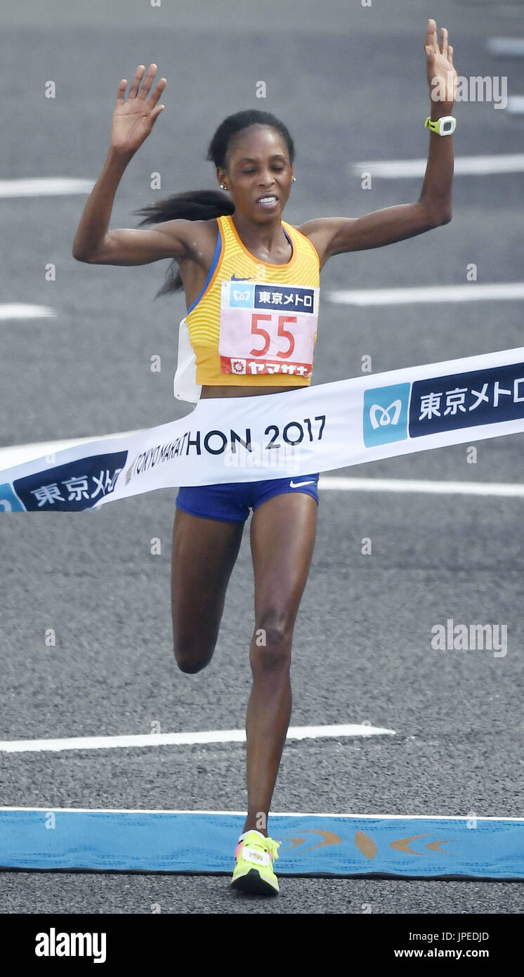 Sarah Chepchirchir of Kenya crosses the finish line to win the women's