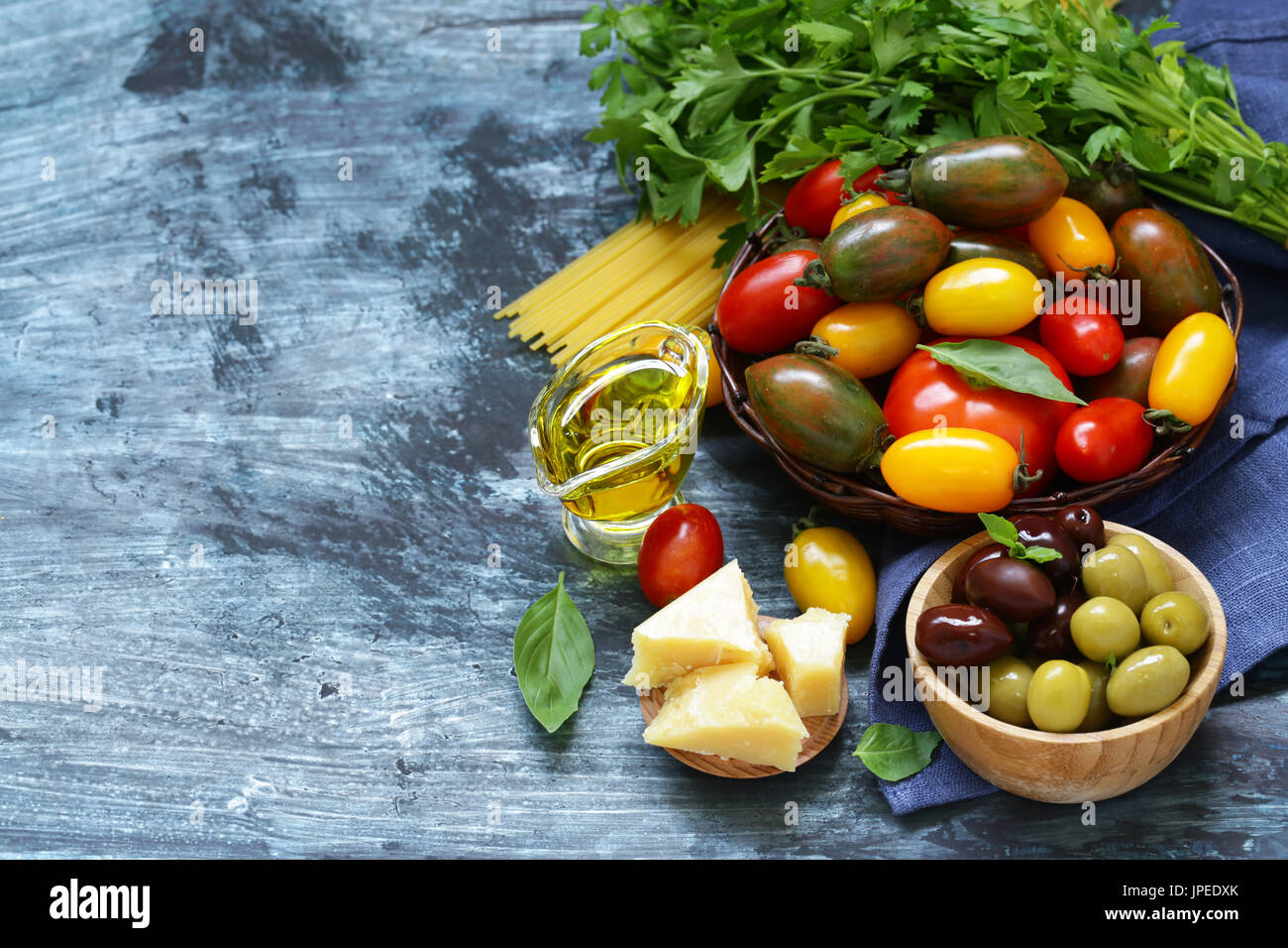 Ripe organic tomatoes in a wicker basket Stock Photo - Alamy
