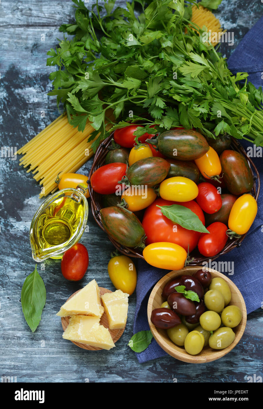 Ripe organic tomatoes in a wicker basket Stock Photo - Alamy