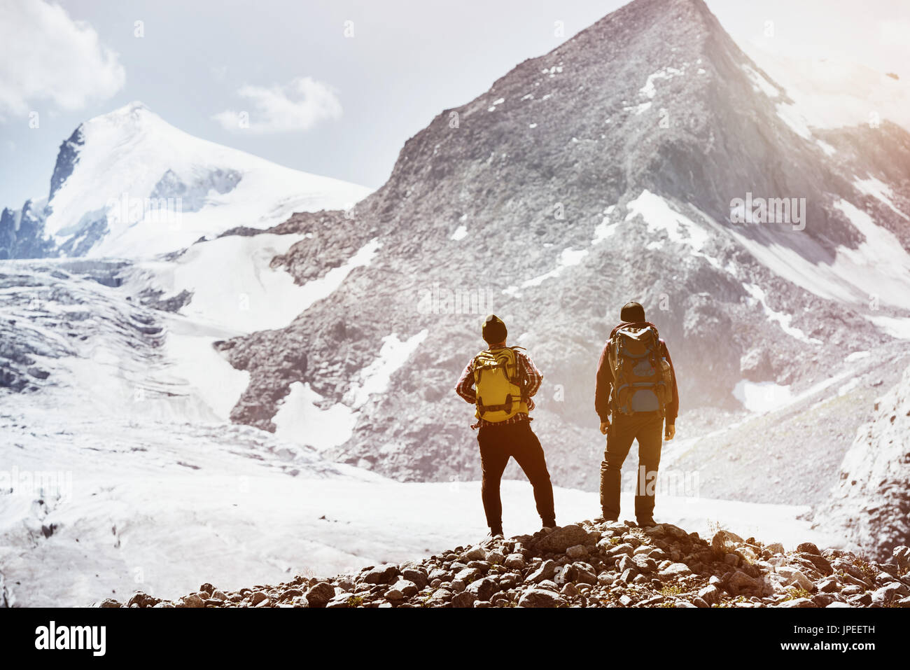 Trekking concept with two friends on mountains background. Spacefor text Stock Photo