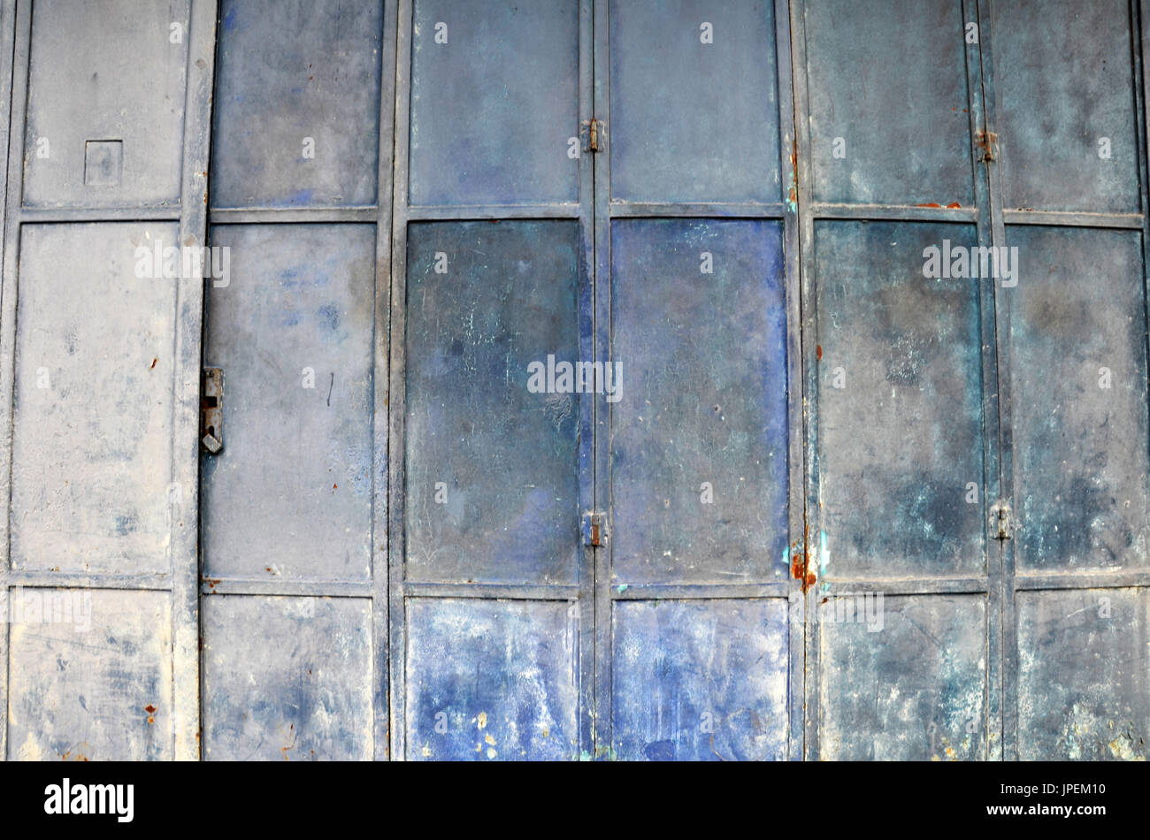 Vintage and old blue metal door with rectangular pattern Stock Photo