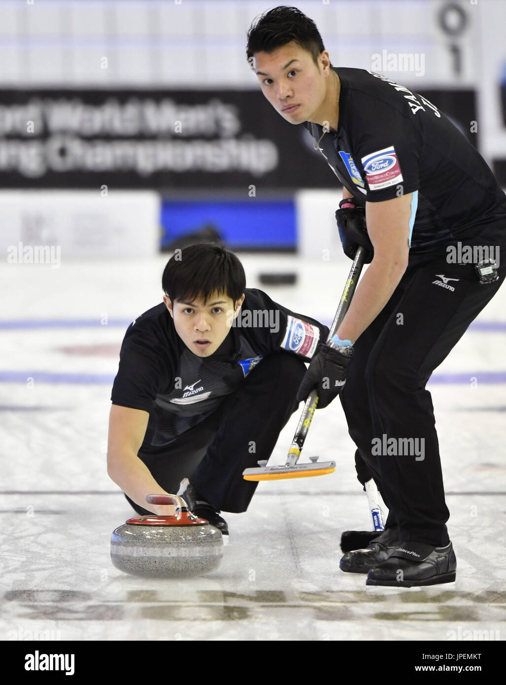 Japan skip Yusuke Morozumi makes a shot during the second end of a men