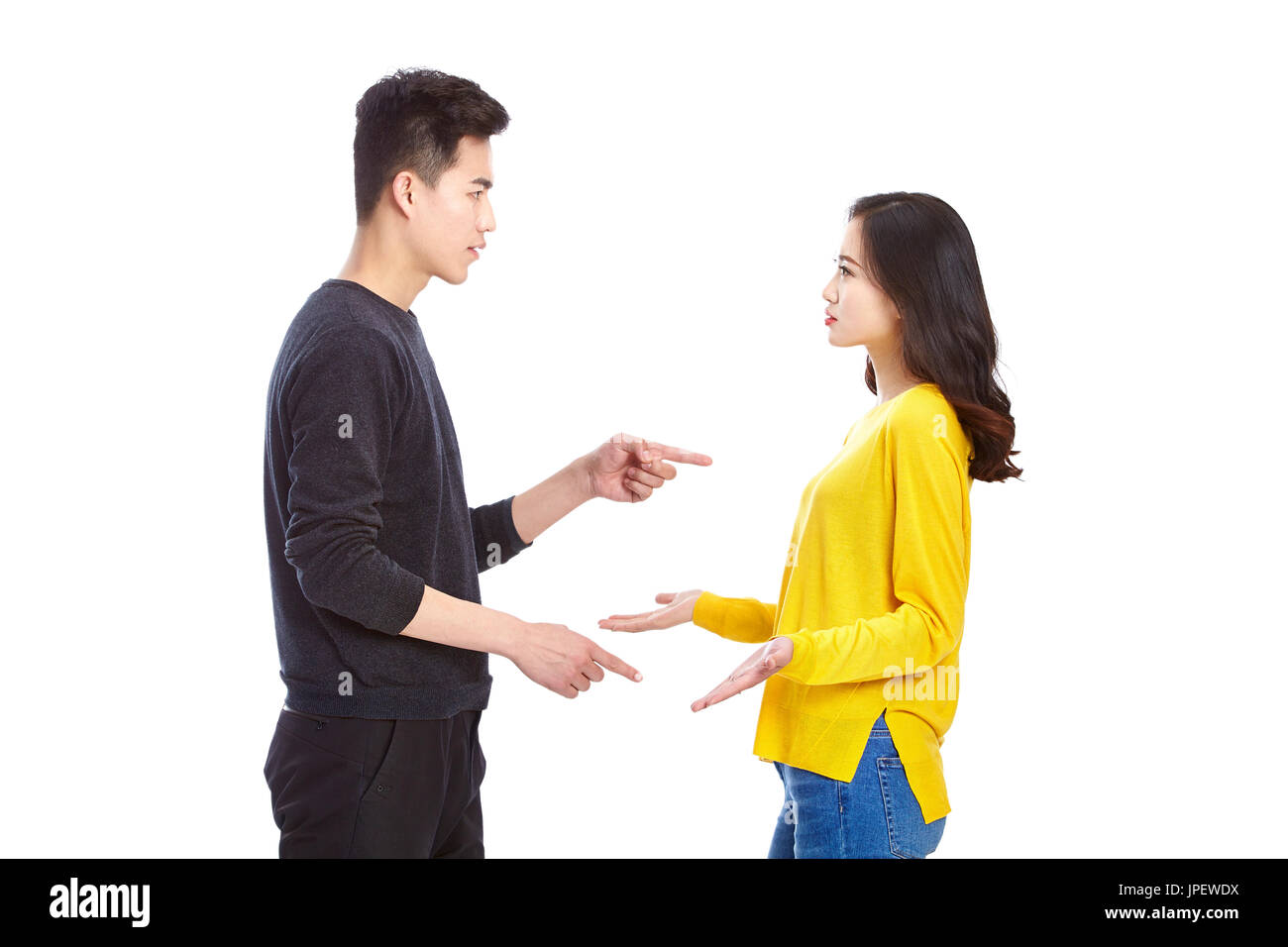 quarreling young asian couple, isolated on white background. Stock Photo