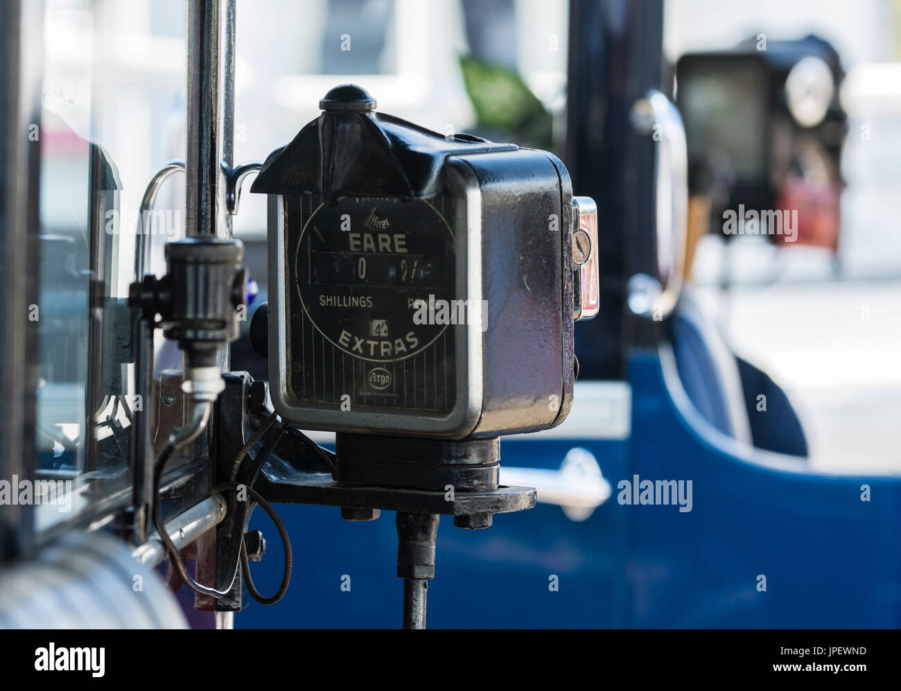 Argo Taximeter from the 1930s fitted to a vintage London taxicab. Taxi fare meter fitted to a vantage Austin Six taxi cab in the UK. Stock Photo