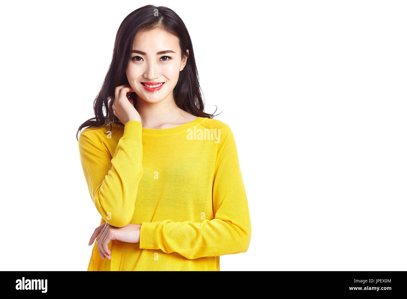 studio portrait of young and beautiful asian woman, looking at camera ...