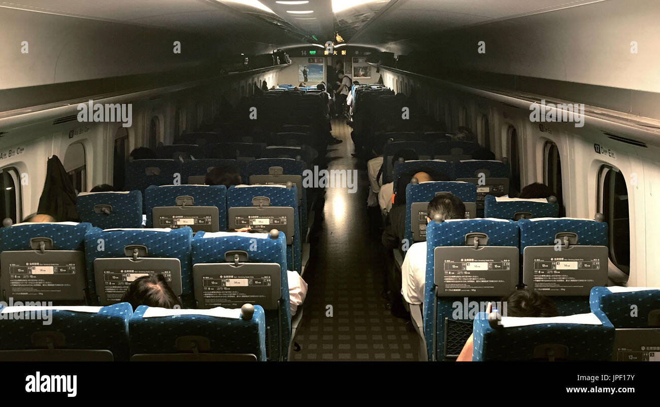 Passengers Sit In The Dark Aboard A Shinkansen Bullet Train In Osaka On passengers-sit-in-the-dark-aboard-a-shinkansen-bullet-train-in-osaka-on
