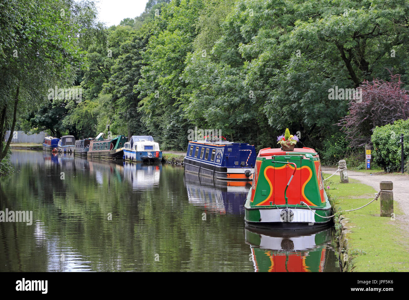 Narrowboats moored along Rochdale Canal, Hebden Bridge, West Yorkshire Stock Photo