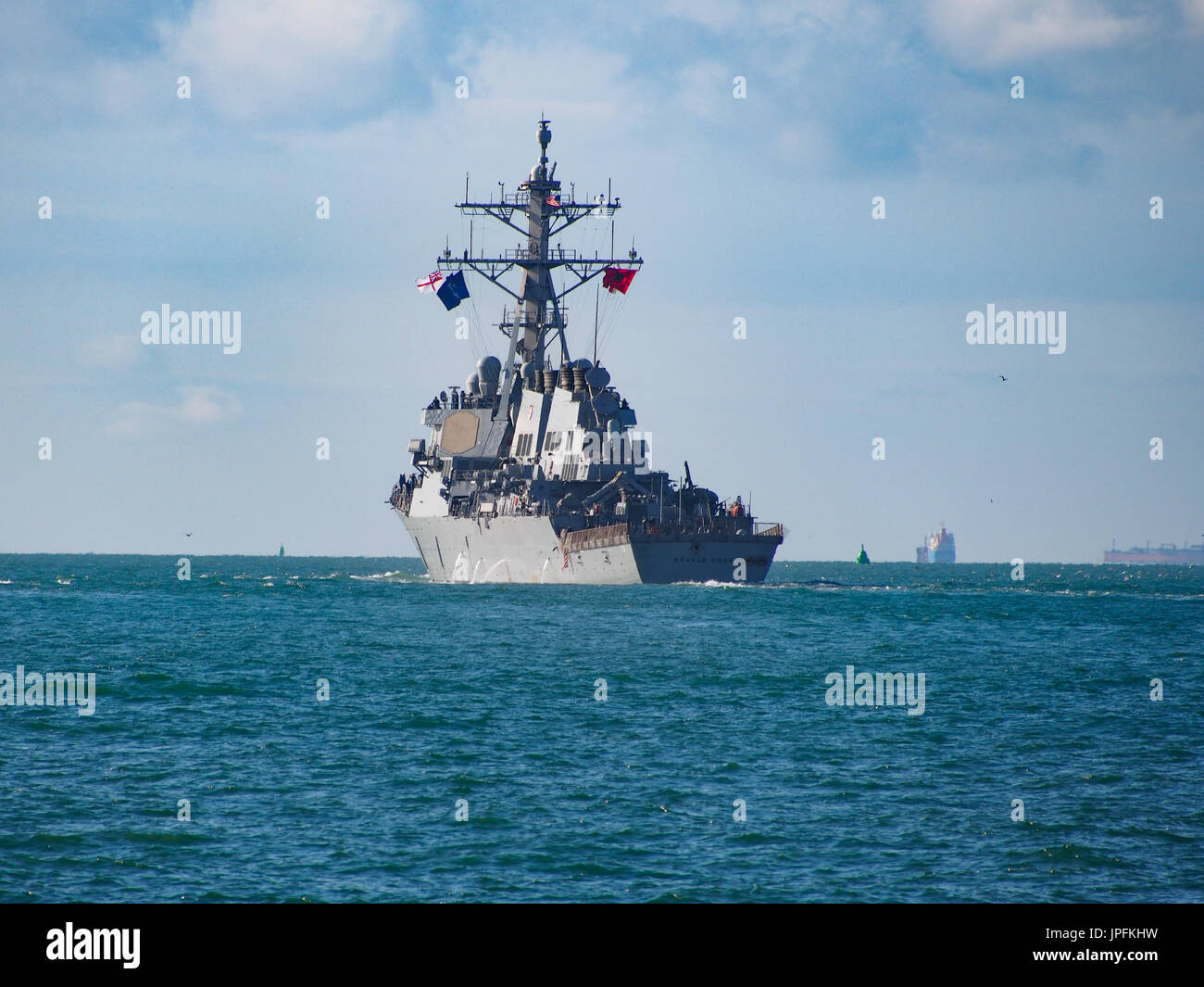 Portsmouth, Hampshire, UK. 01st Aug, 2017. The USS Donald Cook, DDG-75, an Arleigh Burke-class guided missile destroyer, leaves Portsmouth Harbour after a week long visit along with other ships involved in Operation Inherent Resolve, the Global Coalition’s fight against ISIS. Other members of the task group included USS Philippine Sea ,Norwegian ship HNoMS Helge Insgstad and USS George H W Bush a Nimitz class, nuclear powered aircraft carrier. Credit: simon evans/Alamy Live News Stock Photo