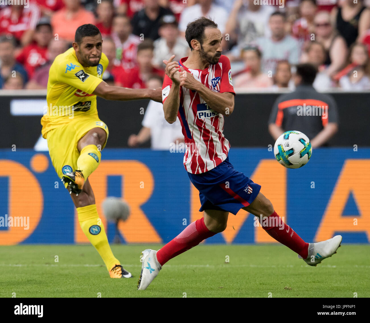 Munich, Germany. 01st Aug, 2017. Madrid's Juanfran (R) and Napoli's Faouzi Ghoulam vie for the ball during the Audi Cup semi-final match pitting Atletico Madrid vs SSC Napoli in the Allianz Arena in Munich, Germany, 01 August 2017. Photo: Sven Hoppe/dpa/Alamy Live News Stock Photo