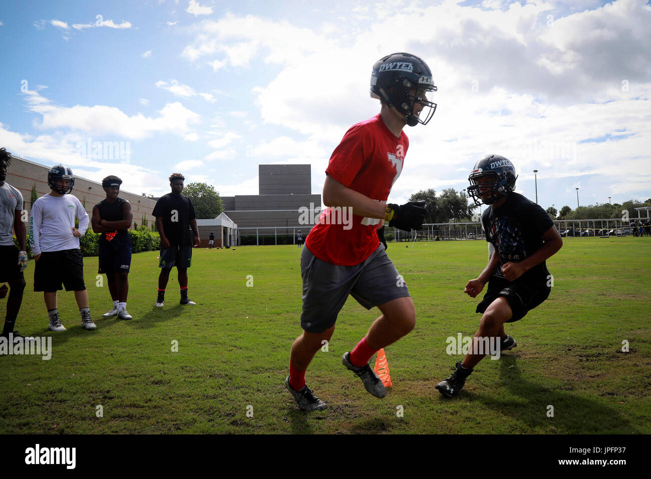 Florida, USA. 1st Aug, 2017. Players perform a tackling drill during
