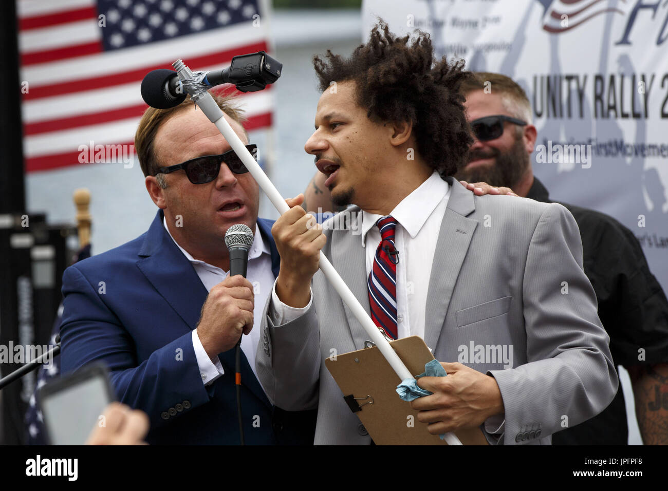 July 18, 2016 - Cleveland, Ohio, U.S. - Comedian ERIC ANDRE talks with with  Infowars show host ALEX JONES during the America First Unity Rally on the  sidelines of the 2016 Republican