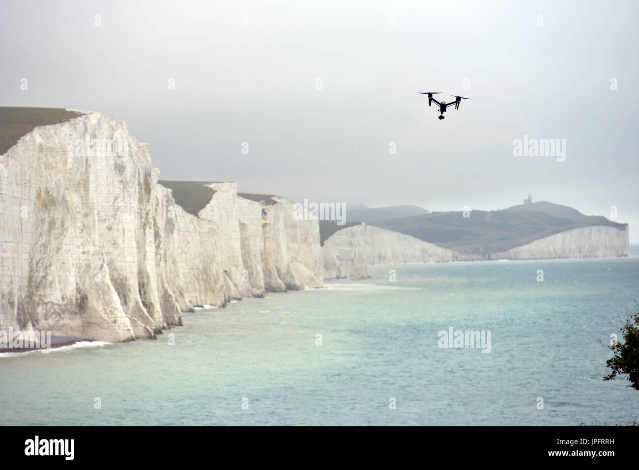 DJI drone flying near the iconic chalk cliffs of the Seven Sisters, East Sussex Stock Photo