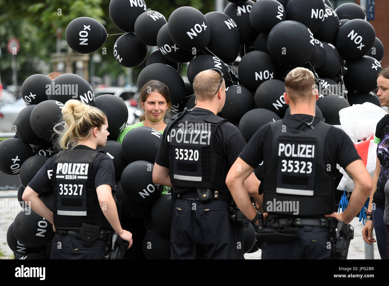 Berlin, Germany. 2nd Aug, 2017. Greenpeace activists protest in front of the Ministry of Transport after a summit on diesel and the reduction of harmful emmissions on August 2, 2017 in Berlin, Germany. The abbreviation NOx on the balloons stands for nitrogen oxide, which is released in high concentration by some diesel motors. It can act as a respiratory poison. Credit: dpa picture alliance/Alamy Live News Stock Photo