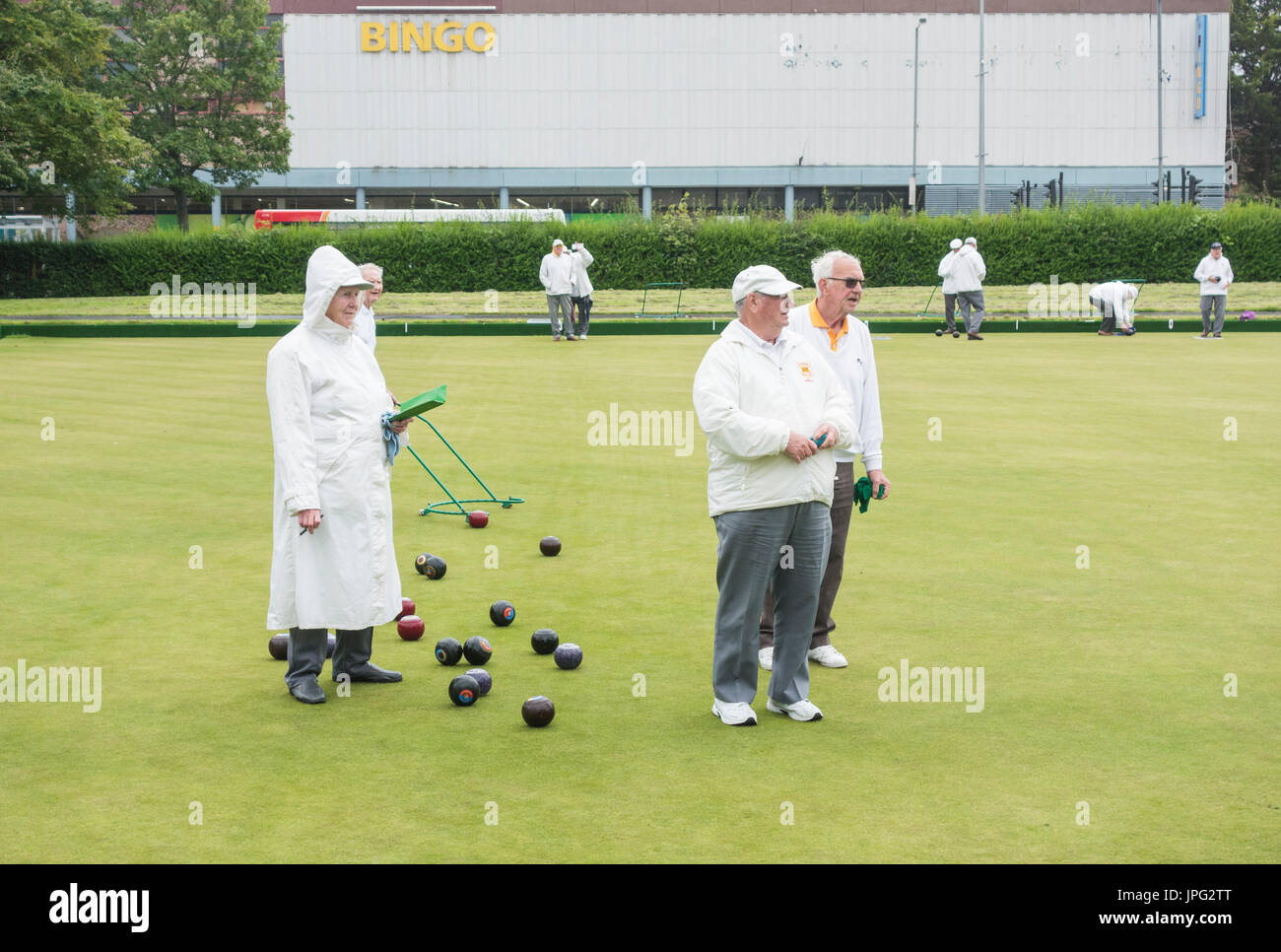 Billingham, north east England, UK. 2nd Aug, 2017. UK Weather: What could be more British than Bowls in the rain in the middle of summer. Members of Billingham bowling club don waterproofs and keep playing as heavy rain eventually arrives in north east England. Credit: ALAN DAWSON/Alamy Live News Stock Photo