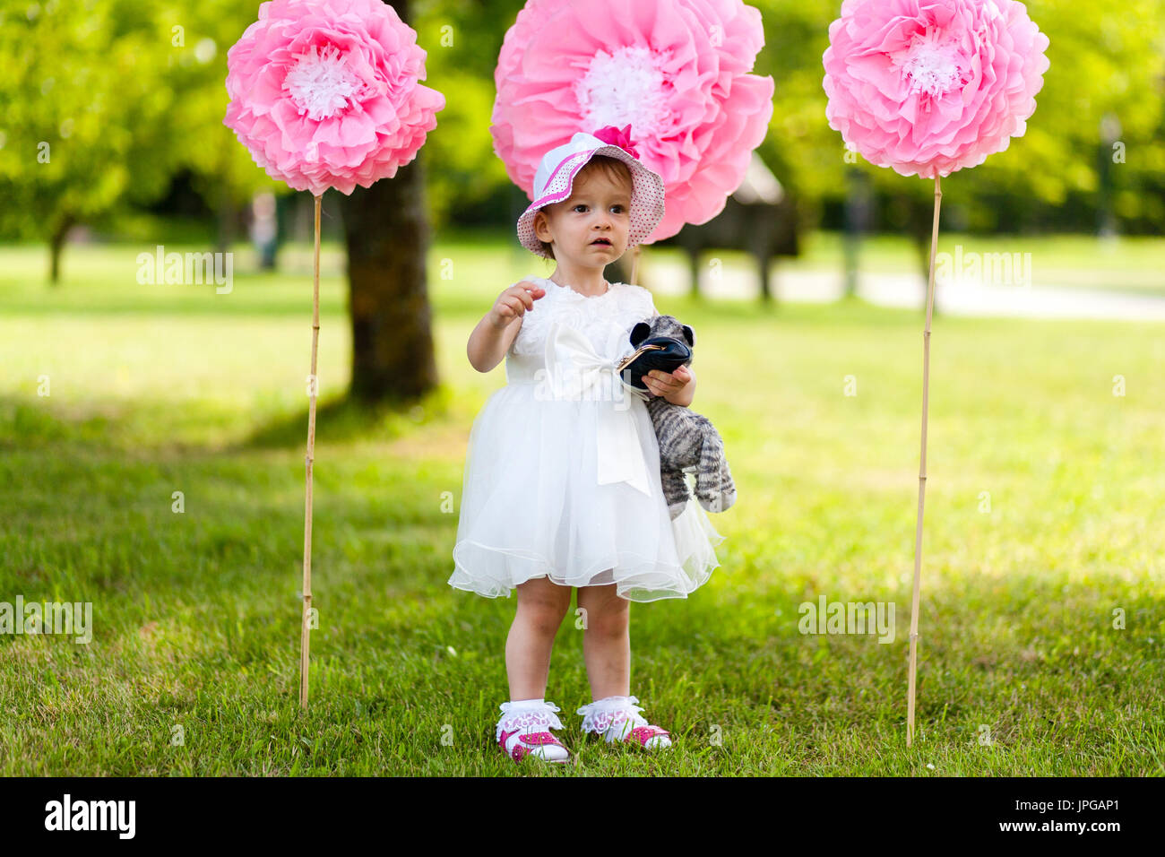 White dress with colorful pom poms 2025