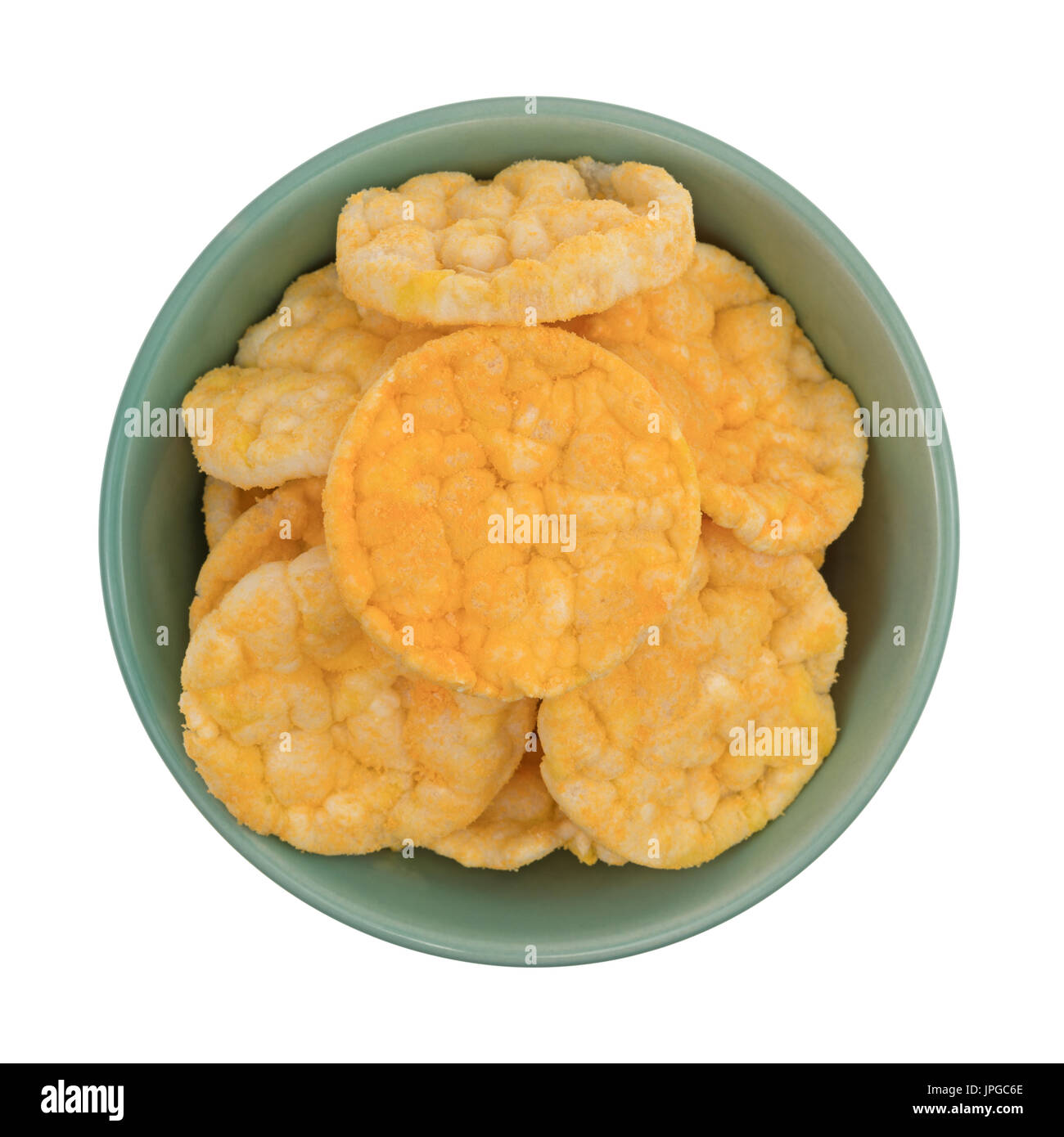 Top view of a bowl filled with cheddar cheese rice cakes isolated on a