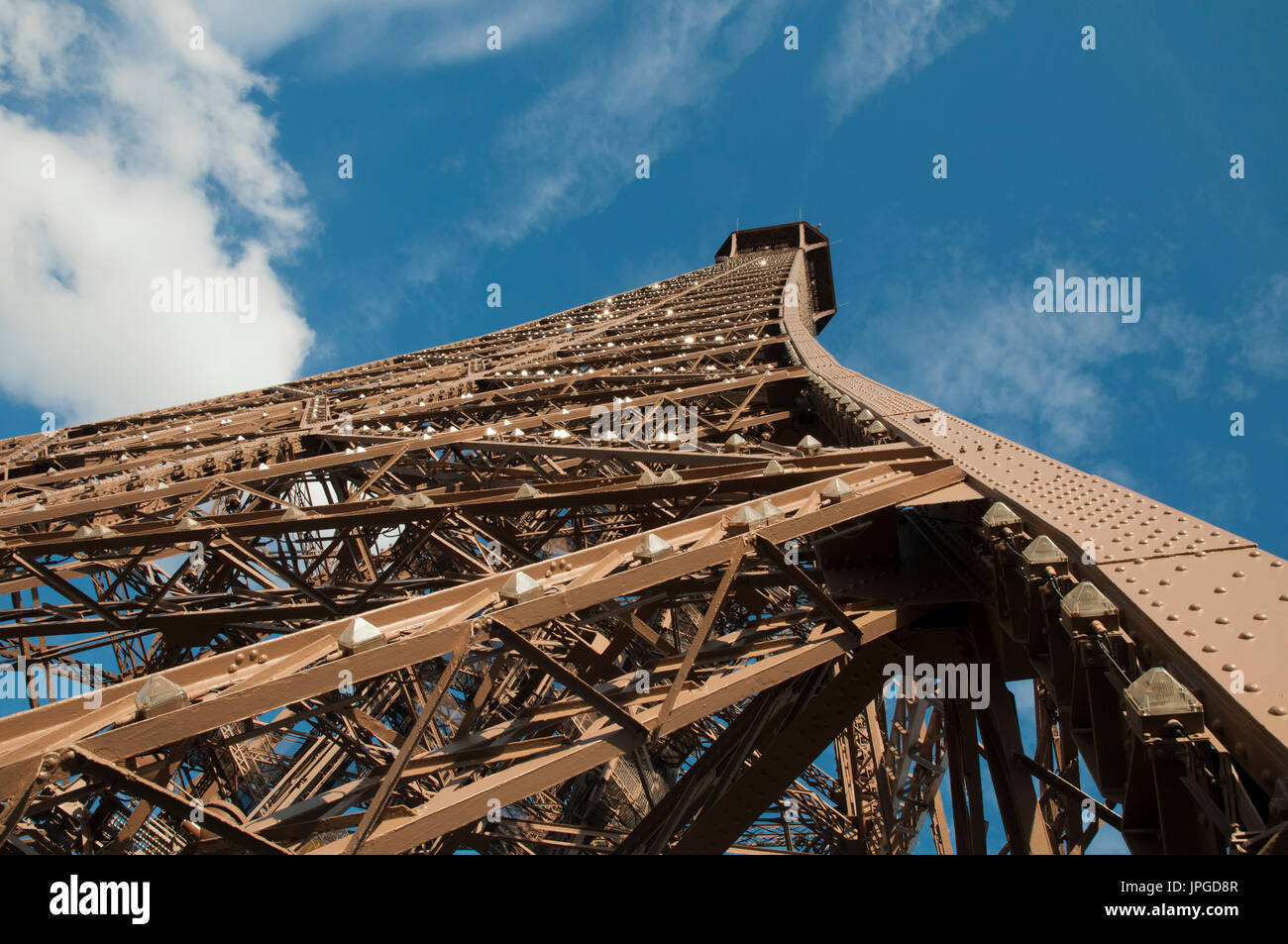 Looking up towards the top of the Eiffel Tower with close up details of the wrought iron lattice structure. Paris, France. Stock Photo