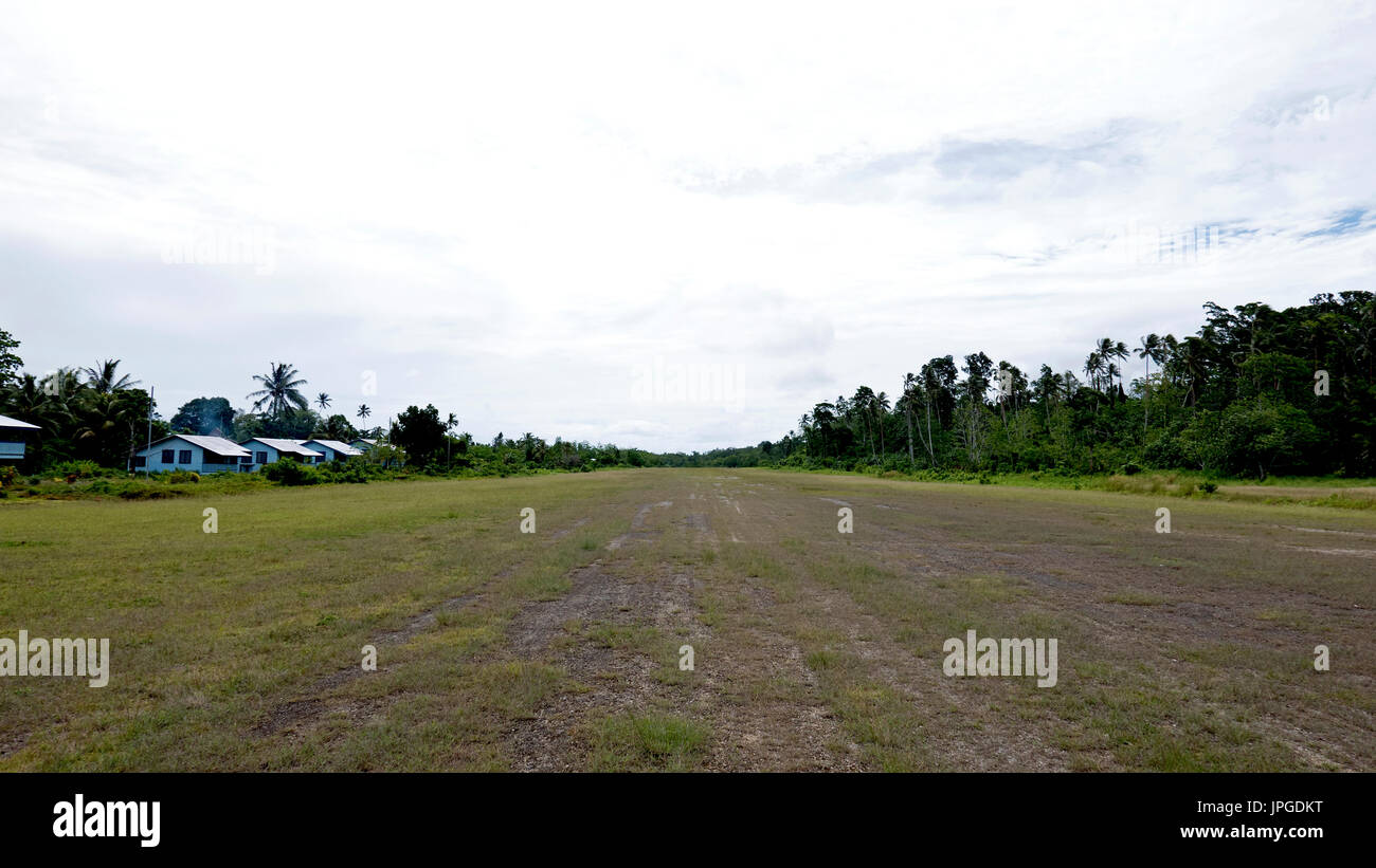 Runway of remote airport of Seghe, entry point to Marovo Lagoon, World Heritage Site, February 2016 Stock Photo