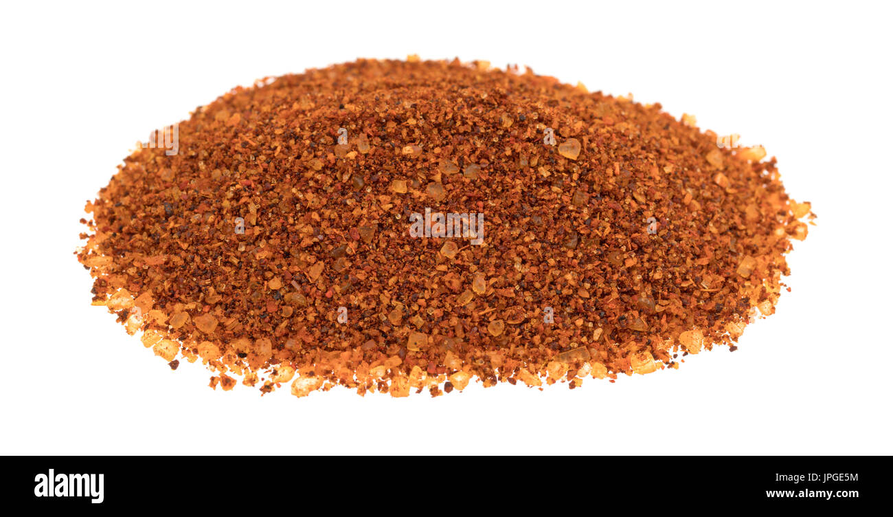 A small pile of habanero pepper seasoning isolated on a white