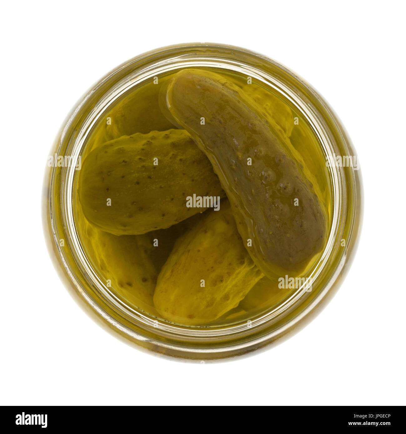 Top view of an opened glass jar filled with kosher baby dill pickles