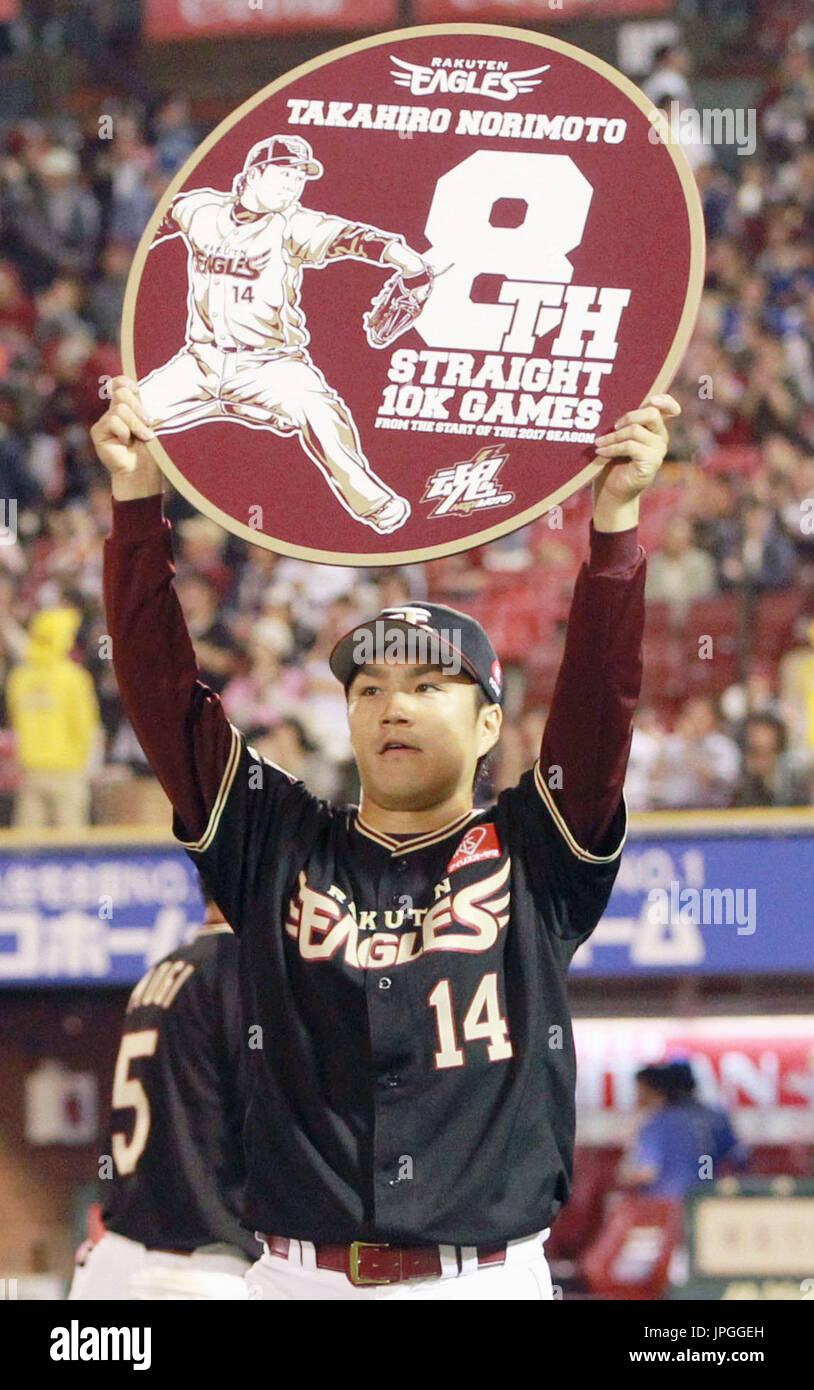 Rakuten Eagles pitcher Takahiro Norimoto holds a commemorative sign at ...