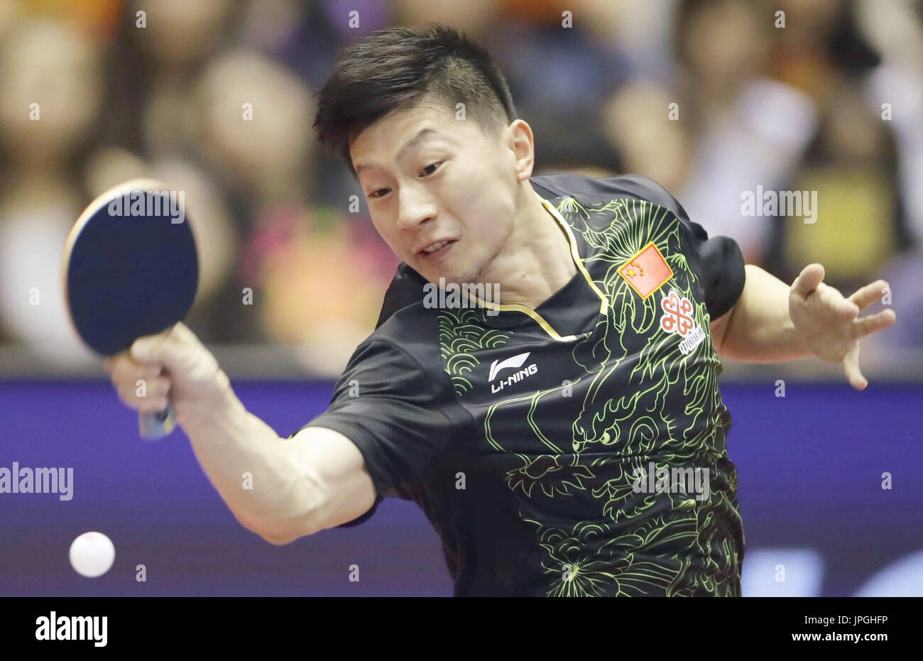 World No. 1 Ma Long of China hits a forehand en route to winning the