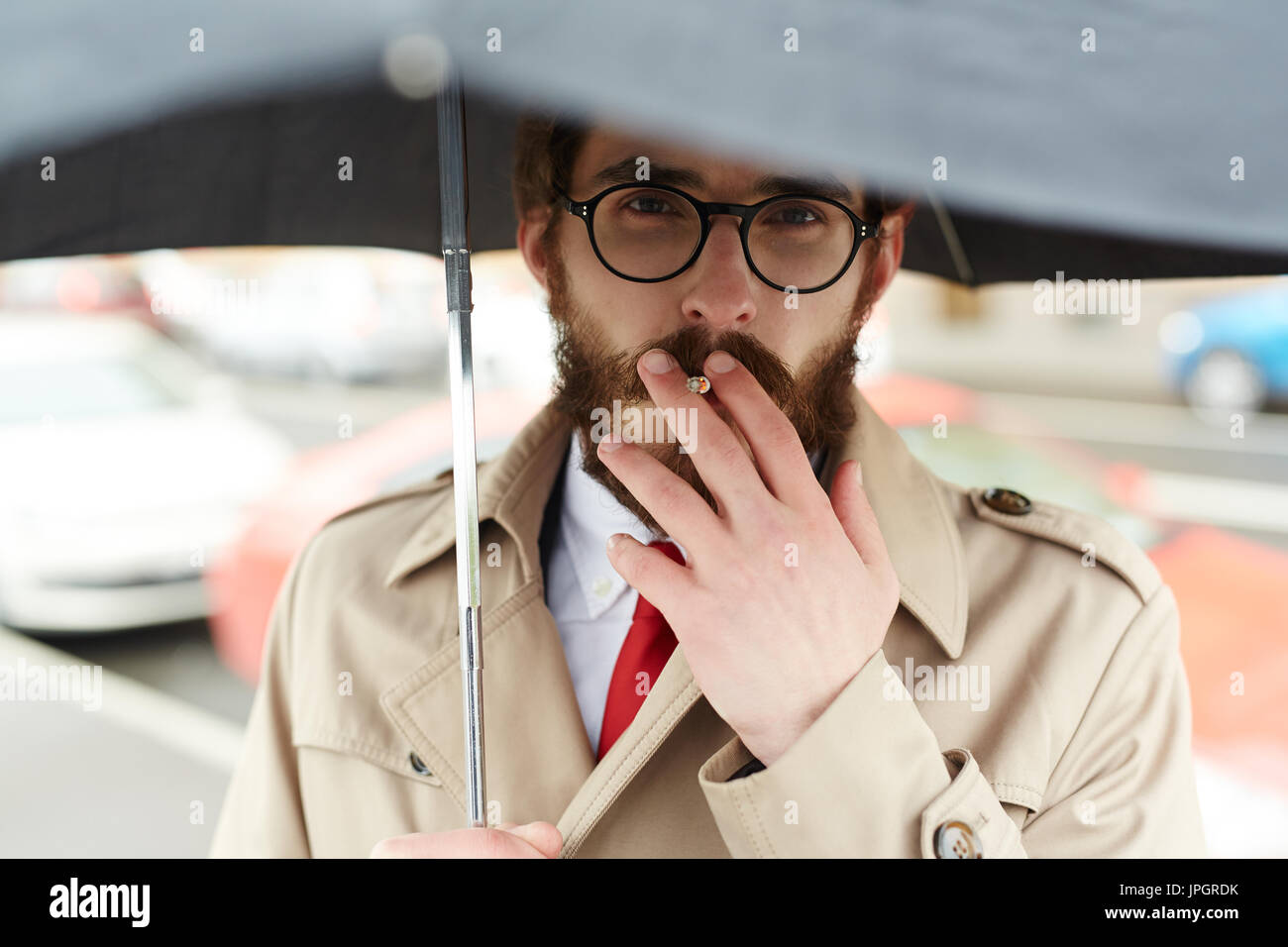 Umbrella cigarette hires stock photography and images Alamy