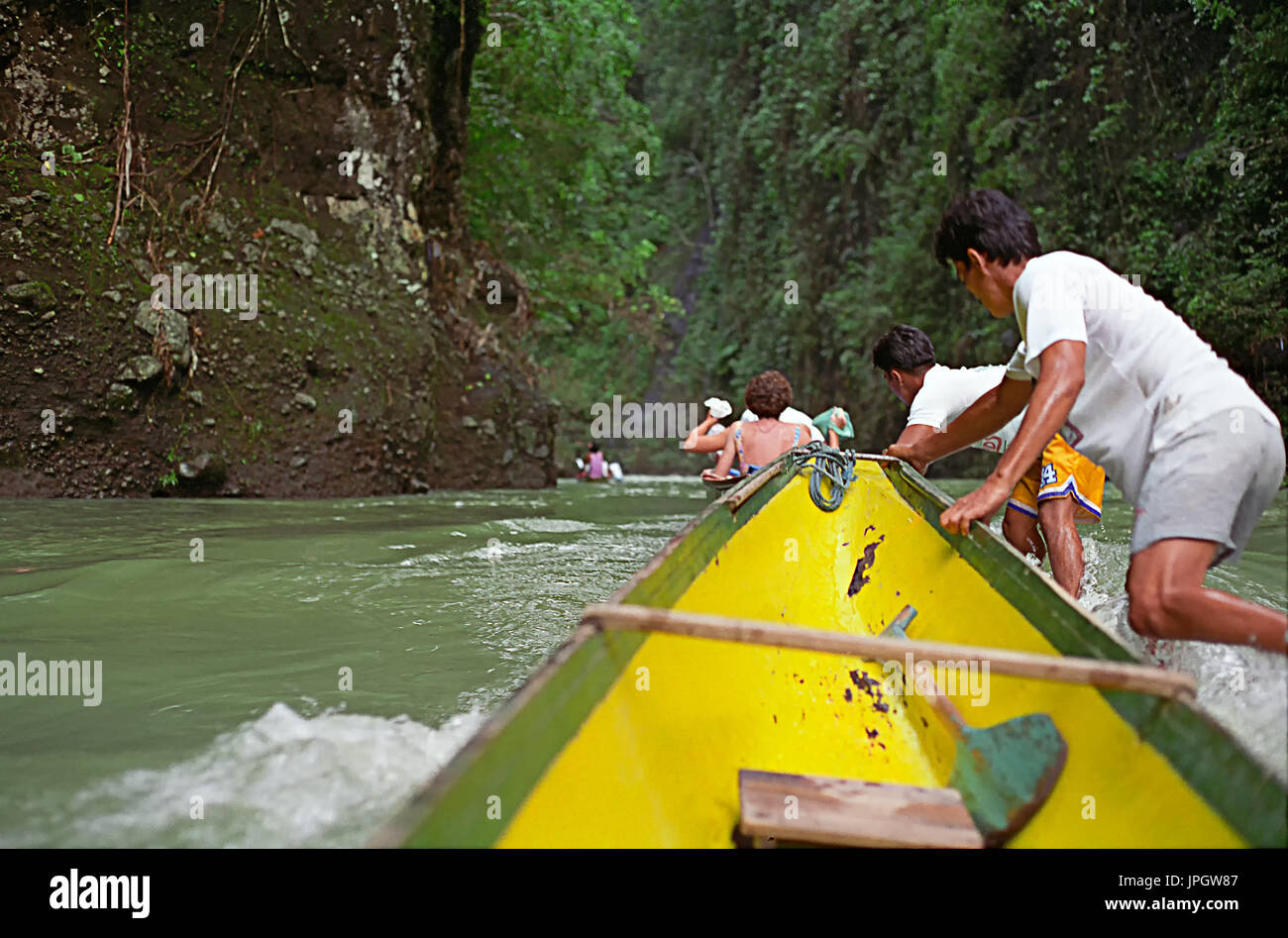 View from a dugout canoe being towed up the Pagsanjan Rapids by local guides, Laguna, Philippines Stock Photo