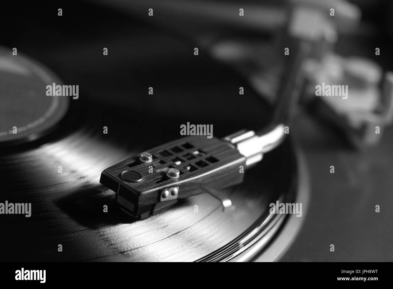 Vinyl playing on a turntable. Vintage and retro theme Stock Photo