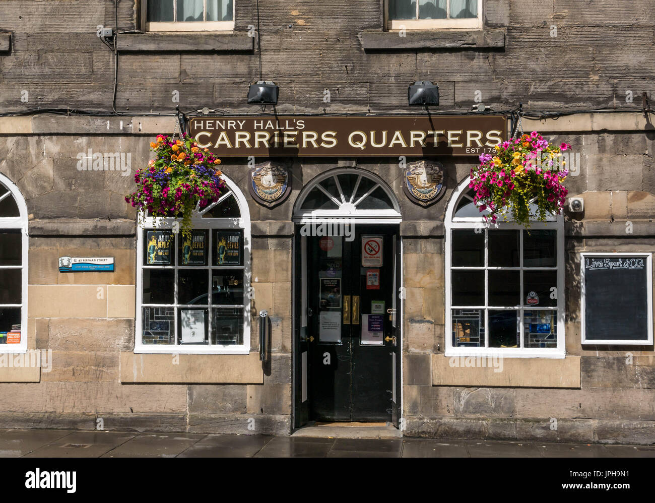 Frontage of old 18th century building of The Carrier's Quarters, claiming to be the oldest wee pub in Leith, Bernard Street, Edinburgh, Scotland, UK Stock Photo