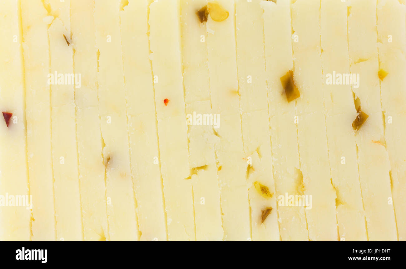 A very close view of fresh pepper jack cheese slices. Stock Photo