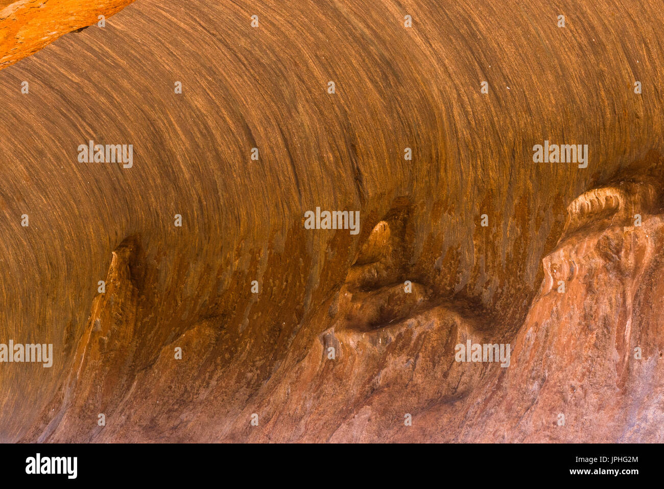 Wave cave rock formation at Uluru aka Ayers rock, Northern Territory, Australia. Stock Photo