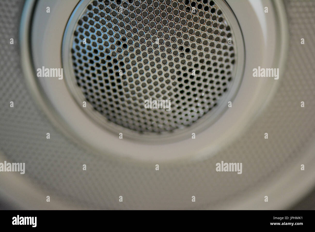 Hole of white speaker Stock Photo Alamy